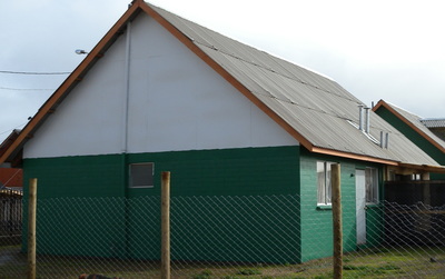 Wooden truss structure supporting light metal roofing, Chile (S. Brzev)