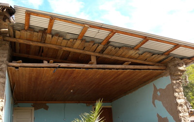 Wooden truss structure supporting wooden planks and steel sheet roofing, Chile (S. Brzev) 